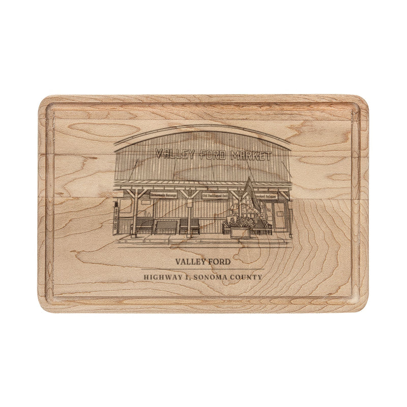 Maple cutting board engraved with a line drawing of the general store on Highway 1 in Valley Ford