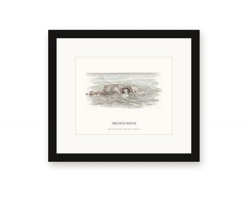 Framed watercolor print of Arched Rock on the Sonoma Coast, with a white mat in a black frame