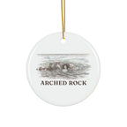 Round ceramic ornament with Arched Rock in watercolor and the place name