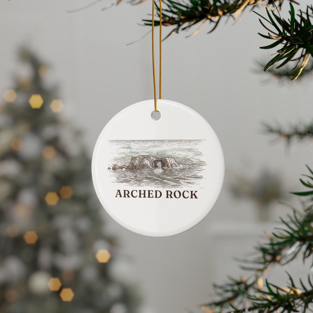 Arched Rock ornament hanging on a Christmas tree