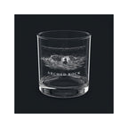 Engraved rocks glass with Arched Rock and the words ARCHED ROCK, shown on a dark background so the engraving stands out