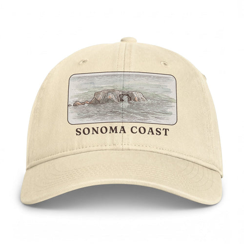 Ivory washed cap with the Arched Rock watercolor printed in a framed panel above SONOMA COAST
