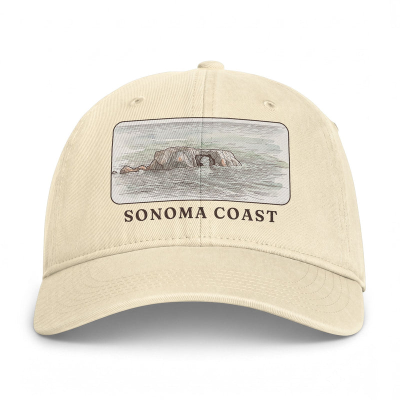 Ivory washed cap with the Arched Rock watercolor printed in a framed panel above SONOMA COAST