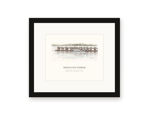 Framed watercolor print of the harbor at Bodega Bay, with a white mat in a black frame