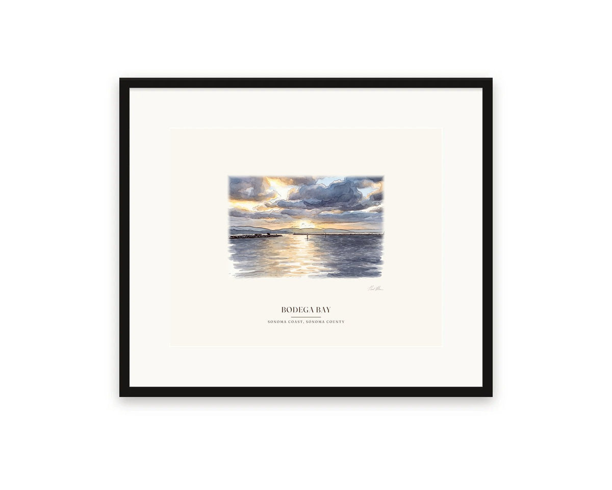 Watercolor print of sunrise over Bodega Harbor, 20 x 16 in, in a black frame with a wide white mat