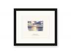 Framed watercolor print of sunrise over Bodega Harbor, with a white mat in a black frame