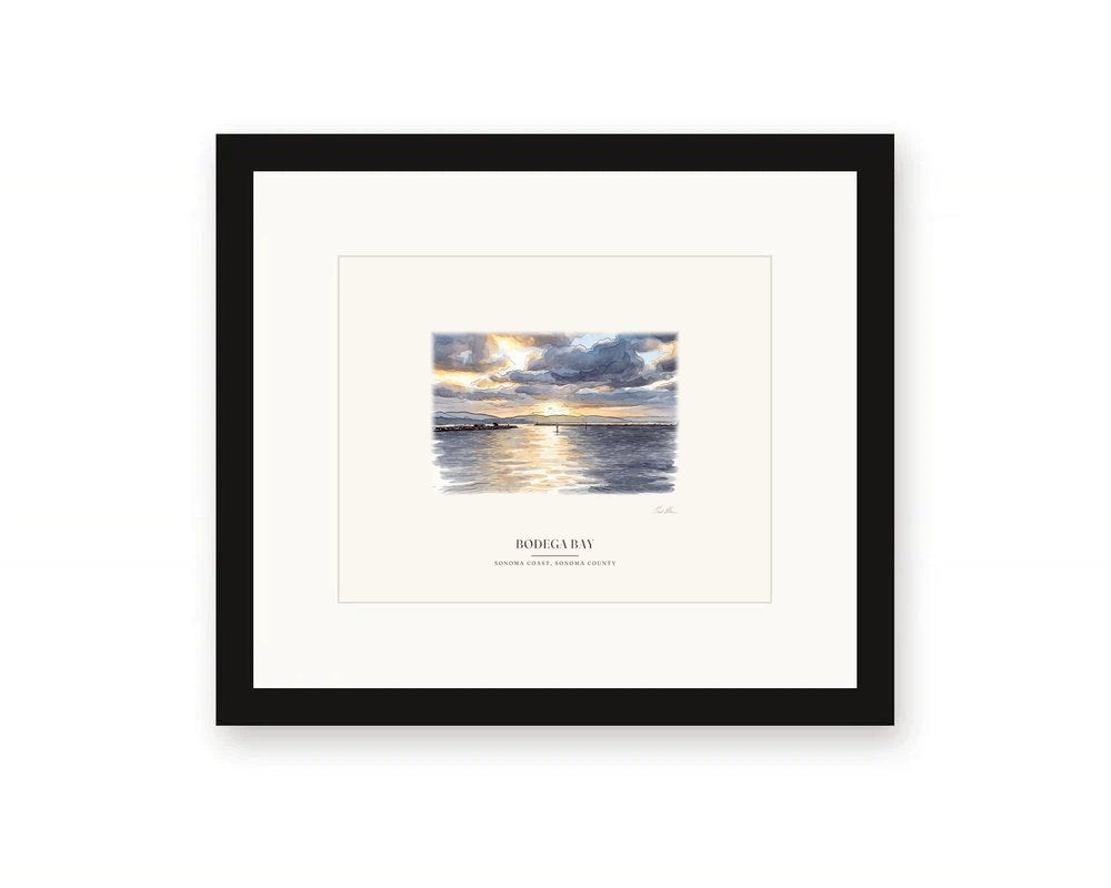 Framed watercolor print of sunrise over Bodega Harbor, with a white mat in a black frame