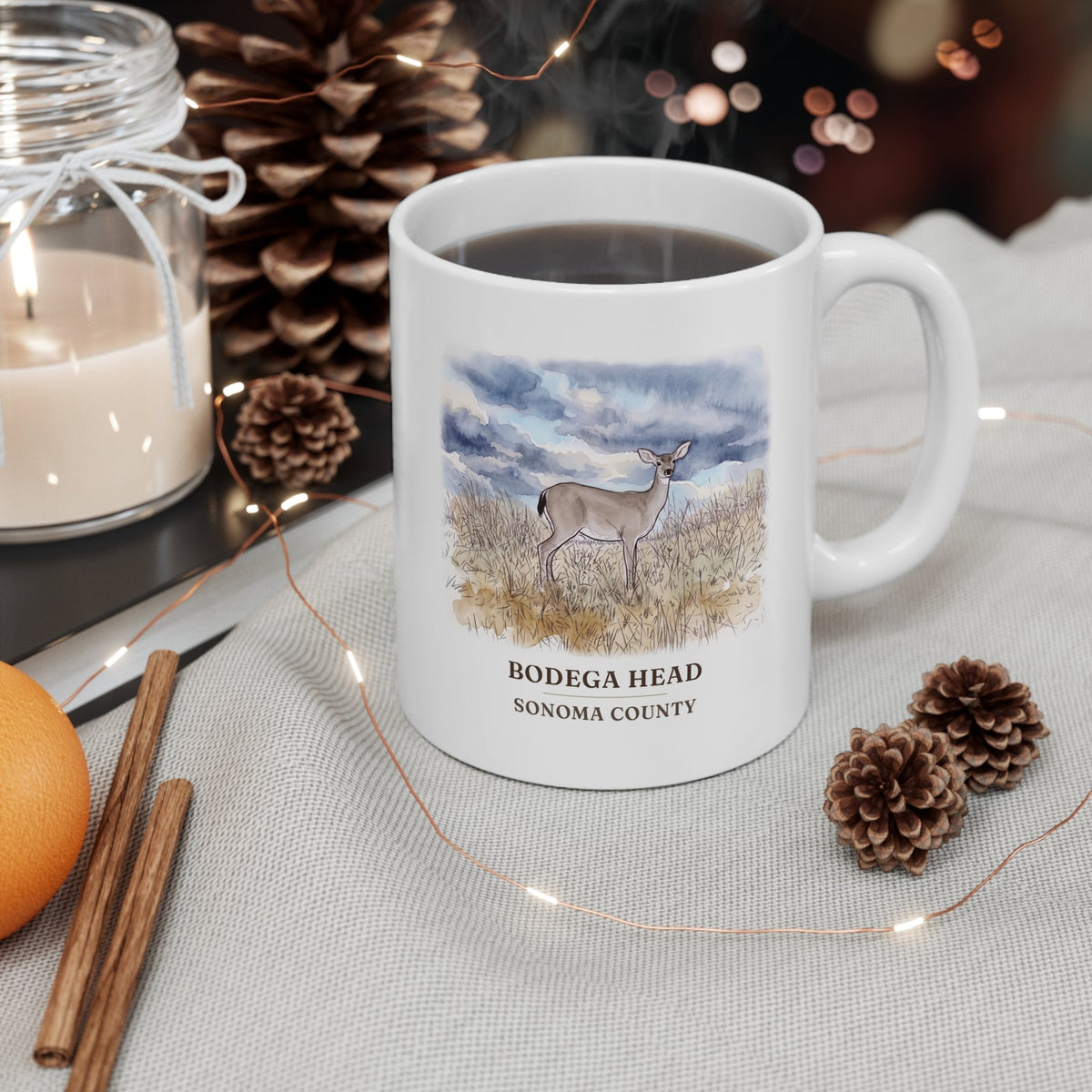 Bodega Head deer mug on a holiday coffee table