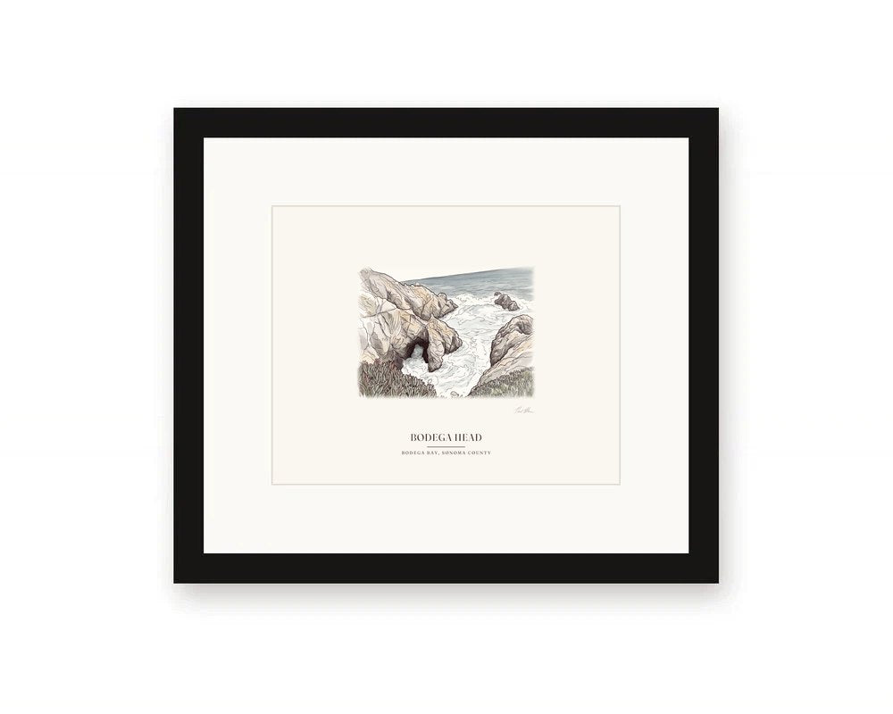 Framed watercolor print of the sea arch at Bodega Head, with a white mat in a black frame