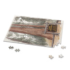 Colonel Armstrong Tree puzzle with a few pieces set beside it