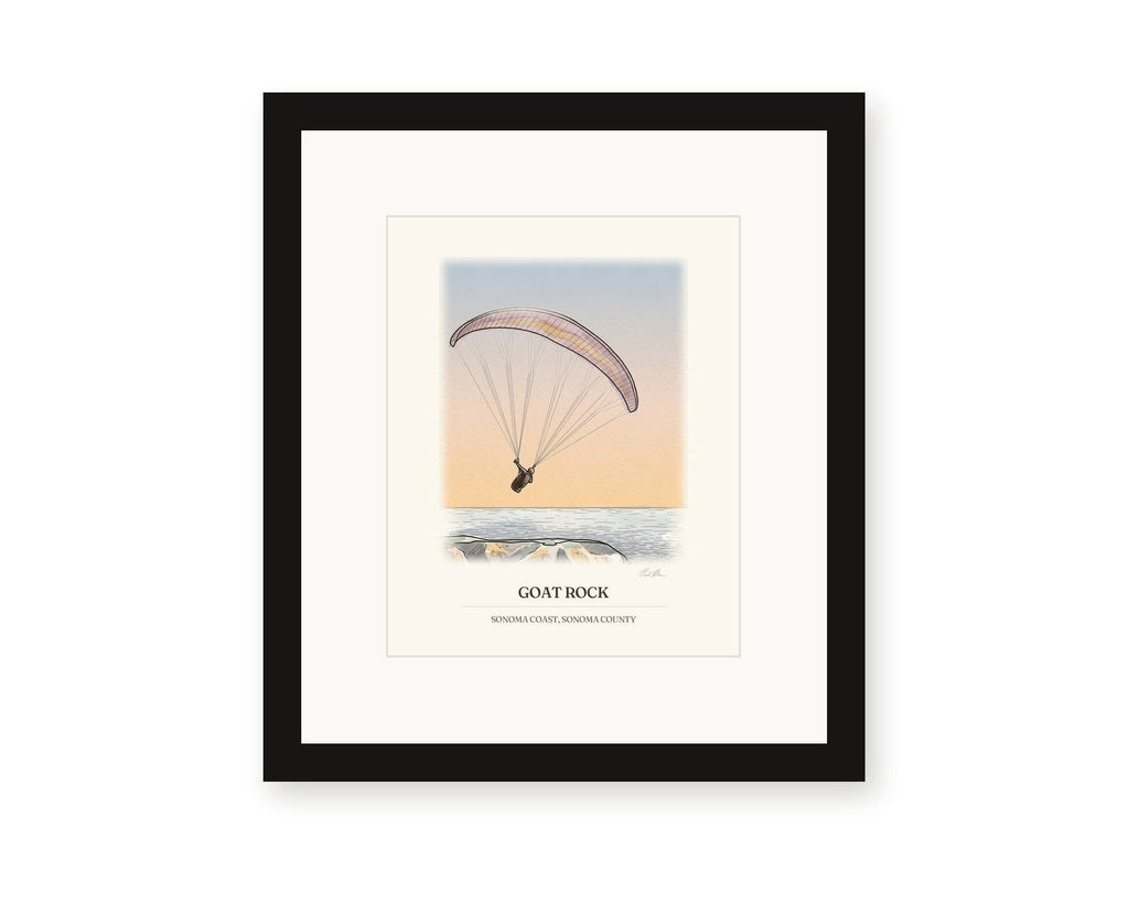 Framed watercolor print of a paraglider over Goat Rock against a sunset sky, with a white mat in a black frame