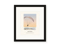 Framed watercolor print of a paraglider over Goat Rock against a sunset sky, with a white mat in a black frame