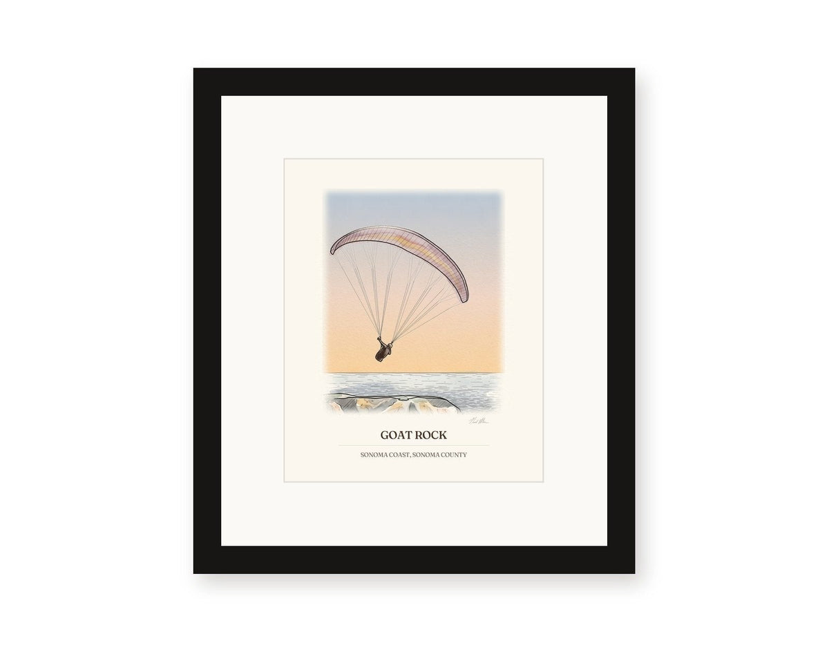 Framed watercolor print of a paraglider over Goat Rock against a sunset sky, with a white mat in a black frame