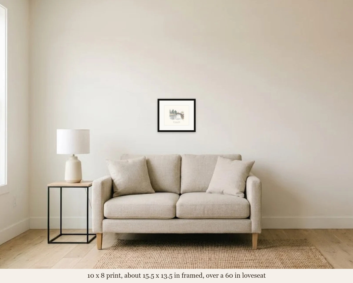 10 x 8 in framed Petaluma River watercolor hanging over a 60 inch loveseat, shown to scale