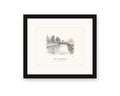 Framed watercolor print of the Petaluma River in downtown Petaluma, with a white mat in a black frame
