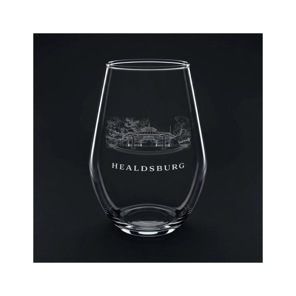 Engraved stemless wine glass with the Healdsburg Plaza gazebo and the word HEALDSBURG, shown on a dark background so the engraving stands out