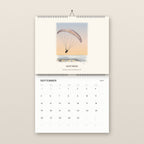 September: a paraglider over Goat Rock, above the September 2027 date grid