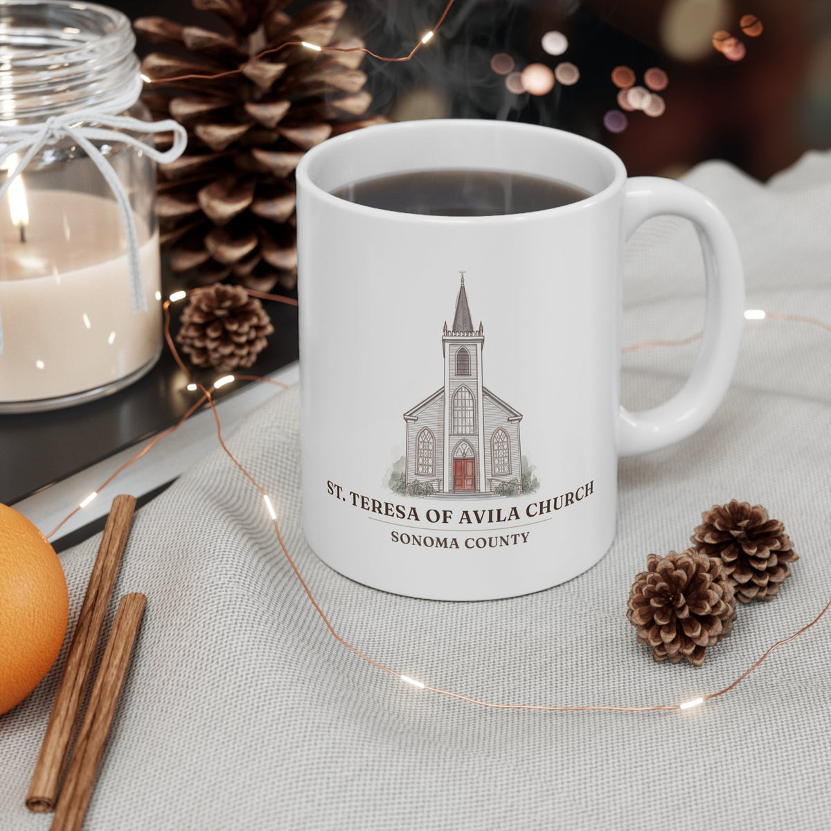 St. Teresa of Avila Church mug on a holiday coffee table