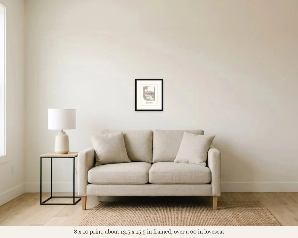 8 x 10 in framed swing bridge watercolor hanging over a 60 inch loveseat, shown to scale