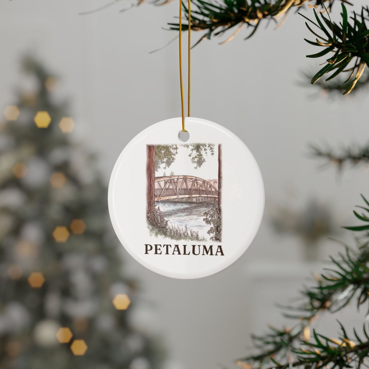 Swing Bridge ornament hanging on a Christmas tree