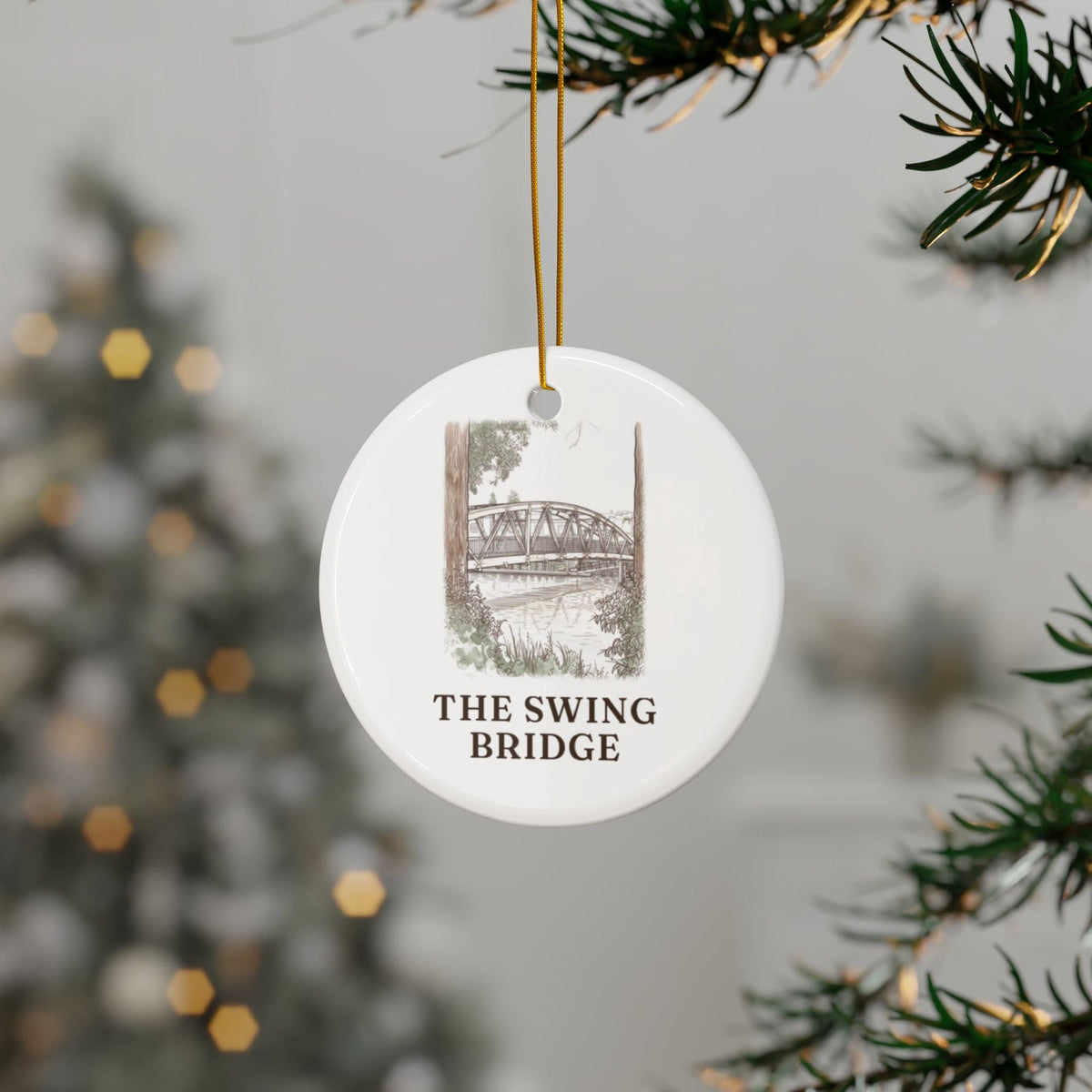 Swing Bridge ornament hanging on a Christmas tree