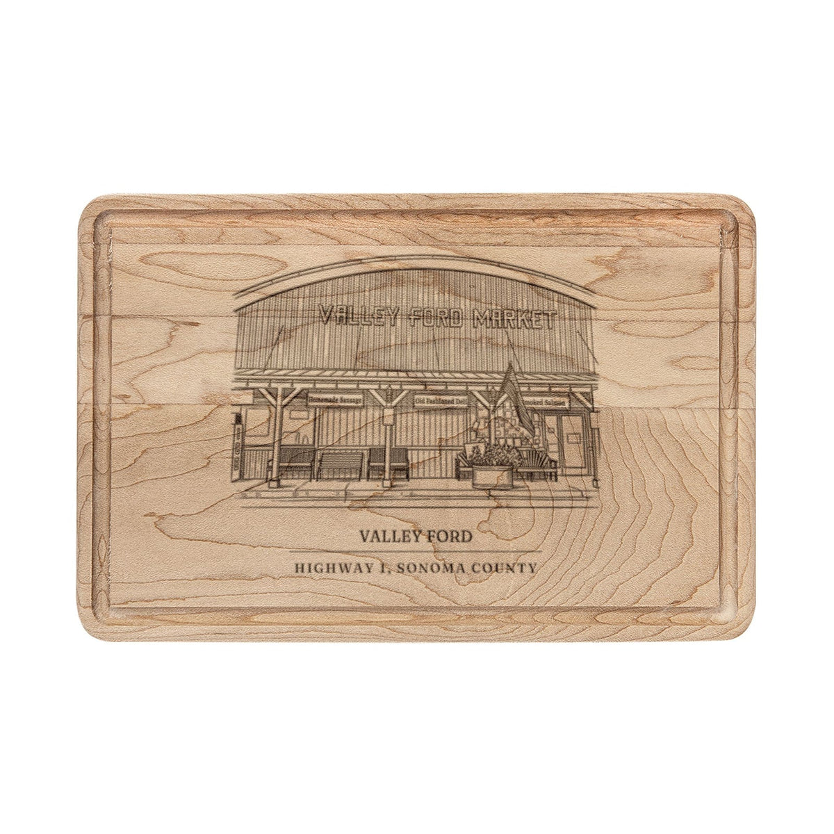 Maple cutting board engraved with a line drawing of the general store on Highway 1 in Valley Ford